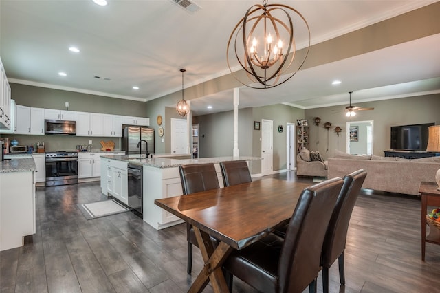 411 E Ross St, Waxahachie, TX 75165 - dining space with recessed lighting, a chandelier, dark wood-style floors, a ceiling fan, and crown molding