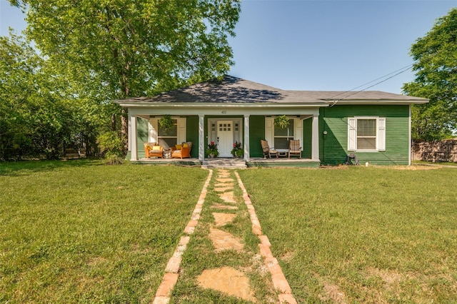411 E Ross St, Waxahachie, TX 75165 - bungalow-style house with a porch, a front lawn, and a shingled roof