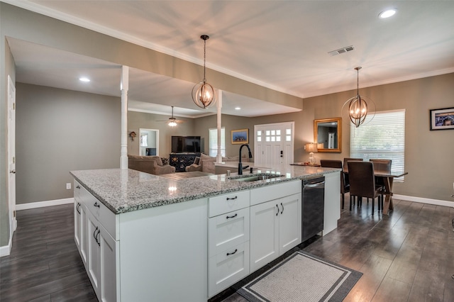 411 E Ross St, Waxahachie, TX 75165 - kitchen with dishwasher, a center island with sink, dark wood-style floors, ceiling fan, and open floor plan