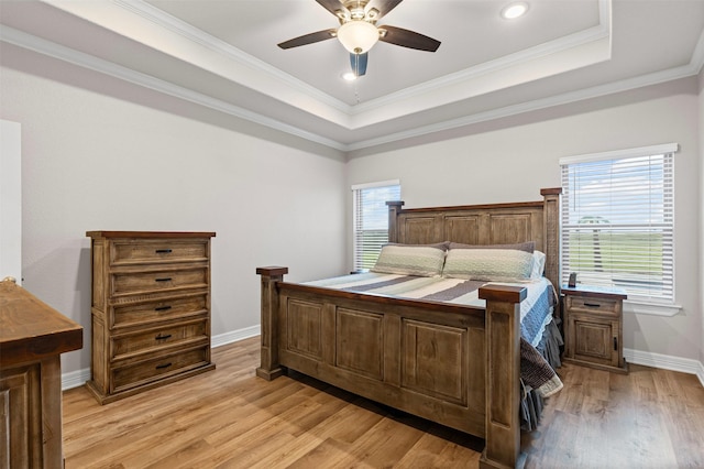 2210 County Road 1104, Cleburne, TX 76031 - bedroom with light wood-style flooring, a tray ceiling, baseboards, ceiling fan, and crown molding