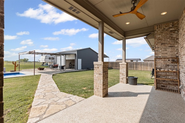 2210 County Road 1104, Cleburne, TX 76031 - view of patio with visible vents, a ceiling fan, fence, an outbuilding, and a fenced in pool