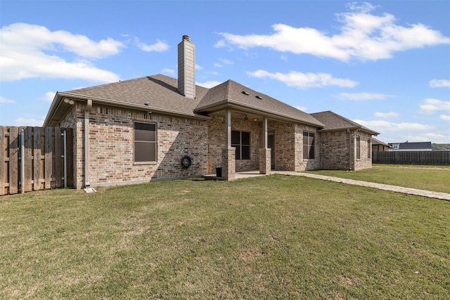 2210 County Road 1104, Cleburne, TX 76031 - rear view of property with fence, a yard, roof with shingles, ceiling fan, and brick siding