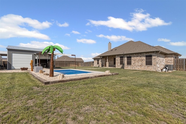 2210 County Road 1104, Cleburne, TX 76031 - back of house featuring a fenced in pool, a fenced backyard, central AC unit, a chimney, and a yard