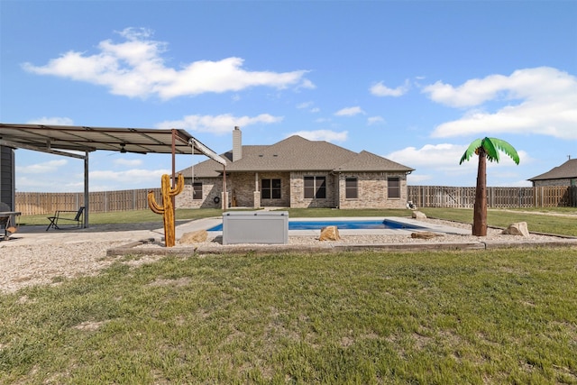 2210 County Road 1104, Cleburne, TX 76031 - back of house with a chimney, fence, a yard, a fenced in pool, and brick siding