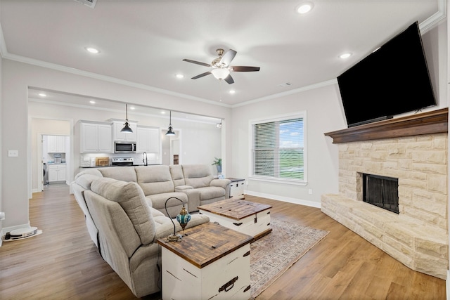 2210 County Road 1104, Cleburne, TX 76031 - living area with light wood finished floors, baseboards, recessed lighting, ceiling fan, and ornamental molding