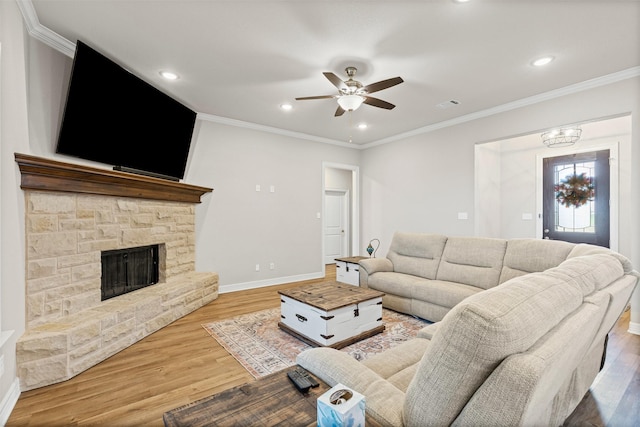 2210 County Road 1104, Cleburne, TX 76031 - living area with light wood finished floors, a stone fireplace, visible vents, a ceiling fan, and baseboards