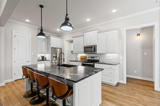 2210 County Road 1104, Cleburne, TX 76031 - kitchen with white cabinets, dark countertops, a sink, baseboards, and appliances with stainless steel finishes