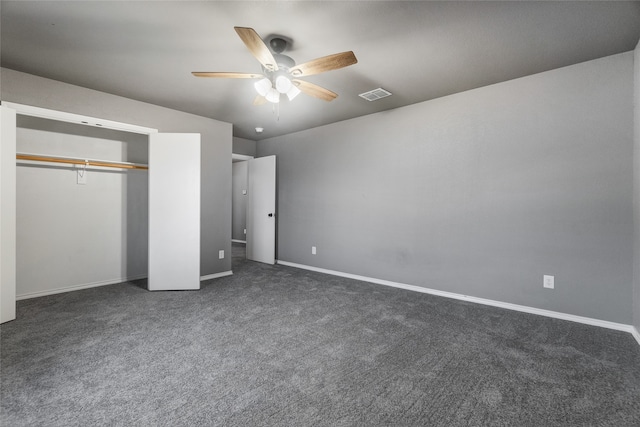 unfurnished bedroom with baseboards, visible vents, a closet, ceiling fan, and carpet floors