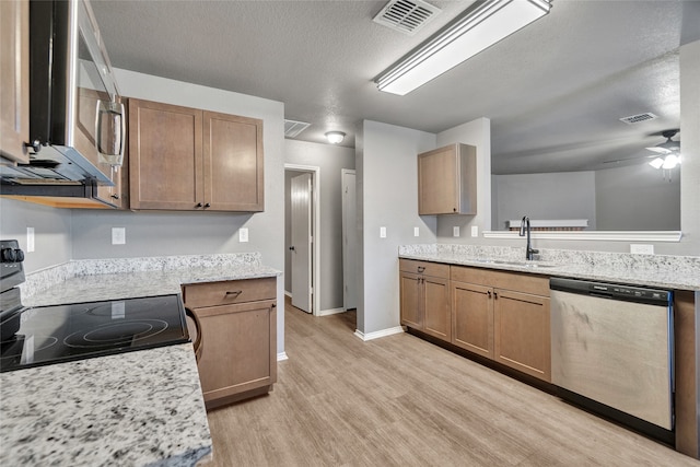 kitchen featuring stainless steel dishwasher, light wood-type flooring, visible vents, a ceiling fan, and black range with electric stovetop