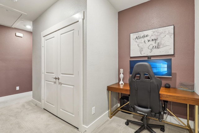 carpeted home office featuring attic access and baseboards