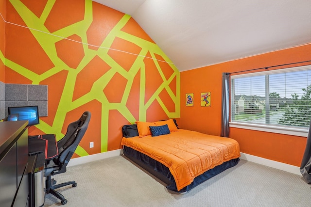 carpeted bedroom featuring baseboards and lofted ceiling
