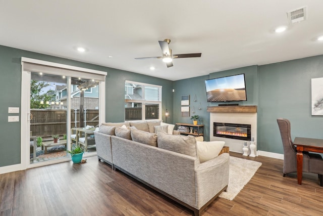616 Emily Ln, Wylie, TX 75098 - living room with a glass covered fireplace, ceiling fan, wood finished floors, baseboards, and recessed lighting