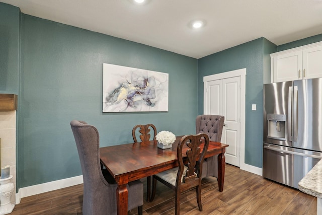dining area featuring recessed lighting, baseboards, and dark wood finished floors