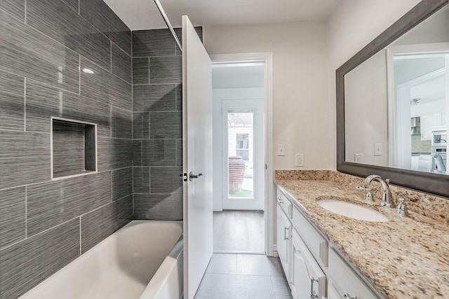 full bathroom featuring bathtub / shower combination, vanity, and tile patterned floors