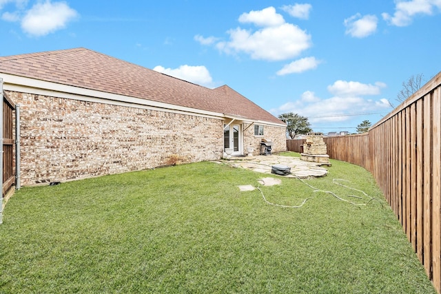view of yard featuring a fenced backyard and a patio