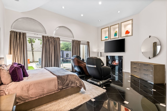 5608 Stone Cliff Ct, Dallas, TX 75287 - bedroom featuring a glass covered fireplace, granite finish floor, baseboards, access to outside, and recessed lighting