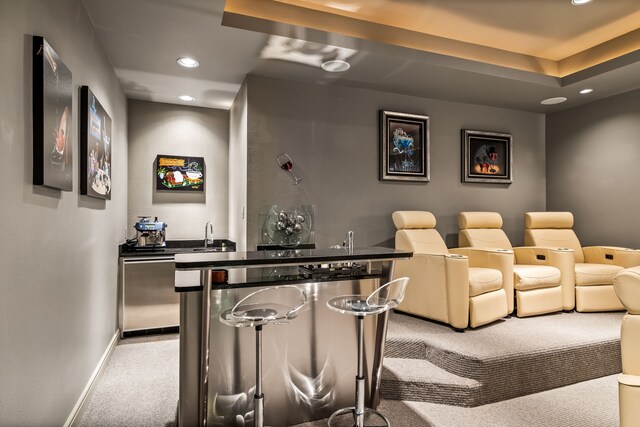 5608 Stone Cliff Ct, Dallas, TX 75287 - home theater with recessed lighting, baseboards, light colored carpet, and indoor wet bar