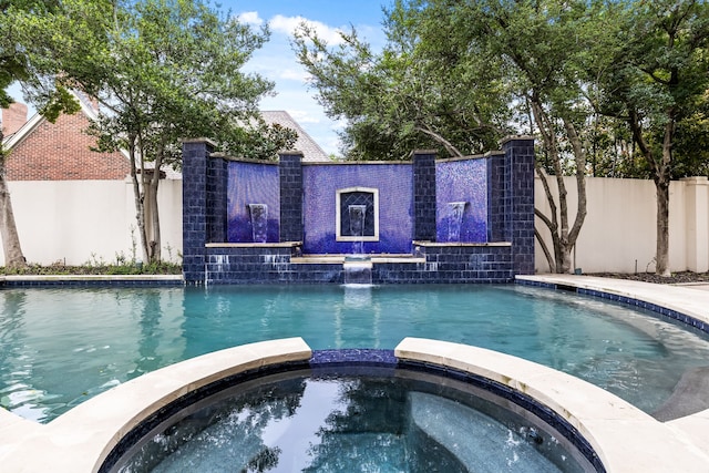 5608 Stone Cliff Ct, Dallas, TX 75287 - view of swimming pool featuring fence and a pool with connected hot tub
