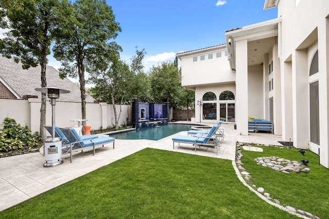 5608 Stone Cliff Ct, Dallas, TX 75287 - view of swimming pool featuring a fenced backyard, a patio area, a fenced in pool, and a lawn