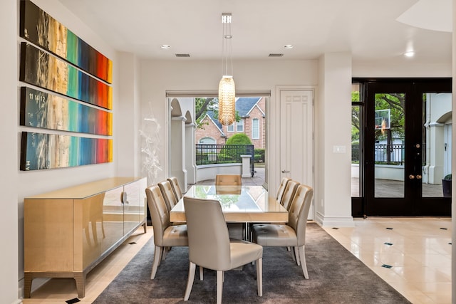 5608 Stone Cliff Ct, Dallas, TX 75287 - dining space featuring visible vents, a wealth of natural light, a notable chandelier, and light tile patterned flooring