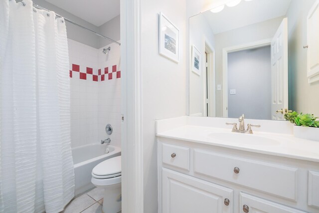 full bath featuring tile patterned flooring, toilet, shower / bath combo, and vanity