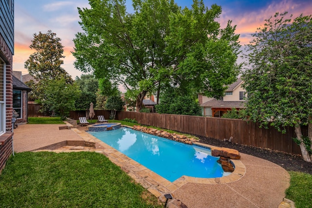 view of pool featuring a patio area and a pool with connected hot tub