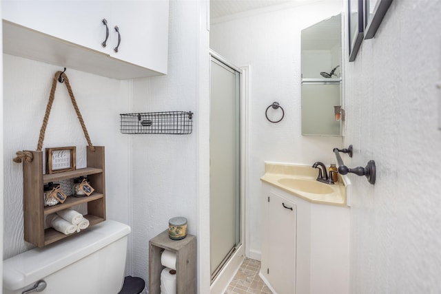 308 N Pecan St, Muenster, TX 76252 - full bathroom featuring brick floor, vanity, a shower stall, and toilet