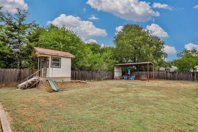 308 N Pecan St, Muenster, TX 76252 - view of yard with a fenced backyard and an outdoor structure