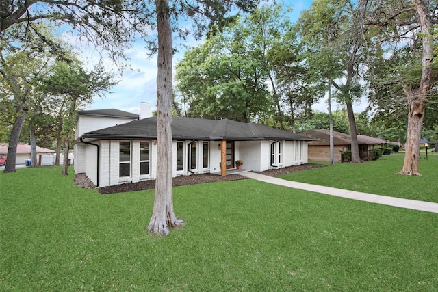 5925 Forest Haven Trl, Dallas, TX 75232 - view of front facade featuring brick siding, a shingled roof, and a front yard