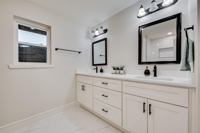 5925 Forest Haven Trl, Dallas, TX 75232 - bathroom featuring marble finish floor, baseboards, a sink, and double vanity
