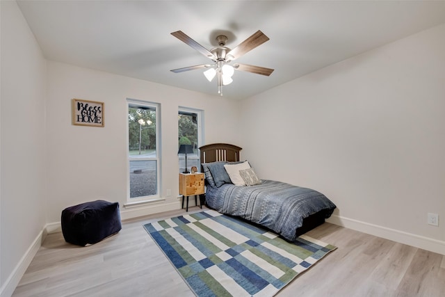 5925 Forest Haven Trl, Dallas, TX 75232 - bedroom with light wood-style flooring, baseboards, and a ceiling fan