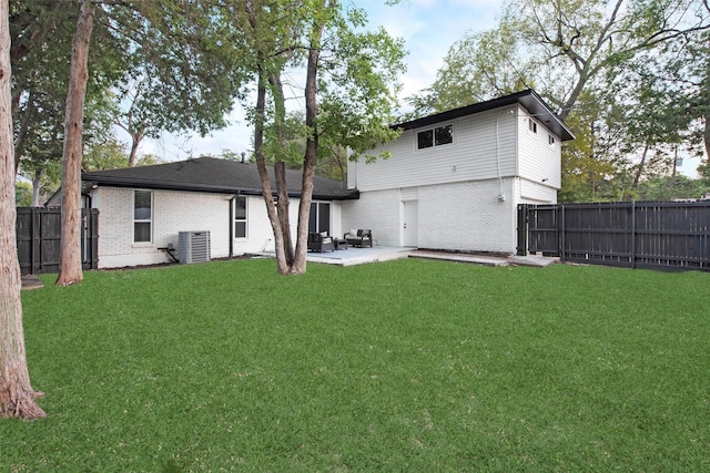 5925 Forest Haven Trl, Dallas, TX 75232 - rear view of property featuring a fenced backyard, brick siding, a yard, and central AC