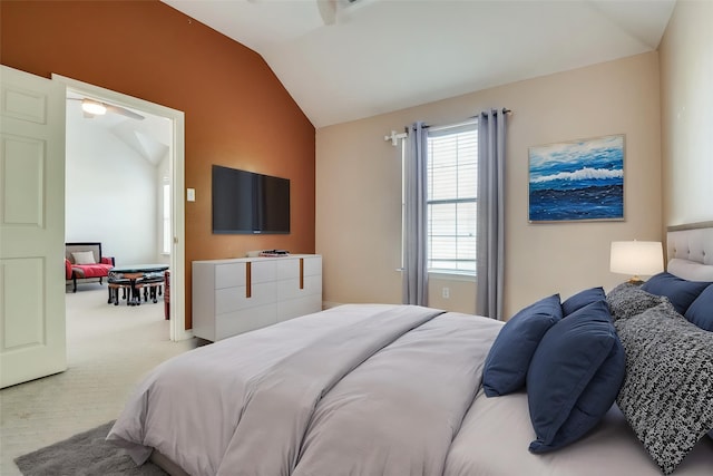carpeted bedroom featuring lofted ceiling