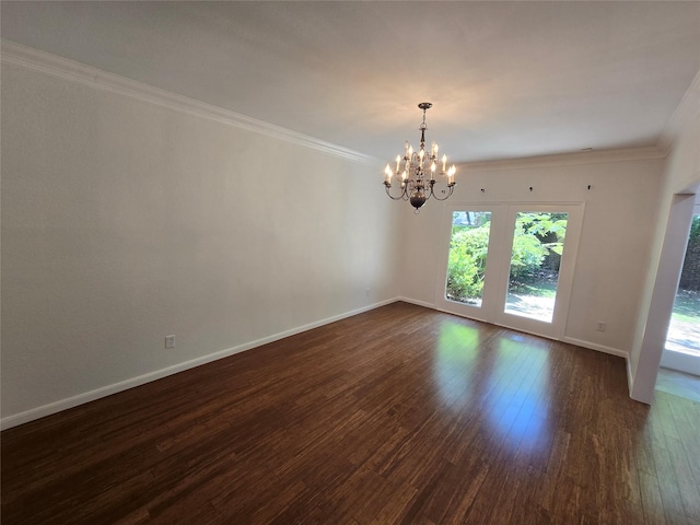 unfurnished room featuring baseboards, a chandelier, ornamental molding, and dark wood-style flooring