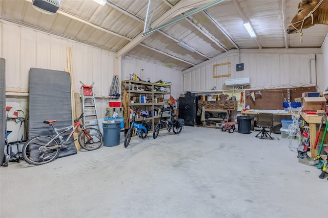 garage with a workshop area and a garage door opener