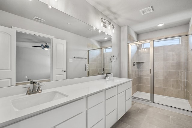 bathroom with a healthy amount of sunlight, a sink, and visible vents