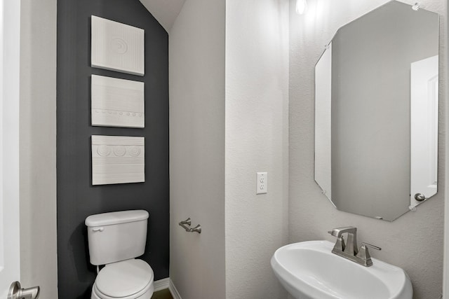bathroom with a sink and toilet