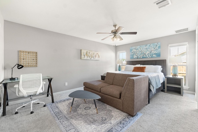 bedroom with carpet, visible vents, baseboards, and ceiling fan