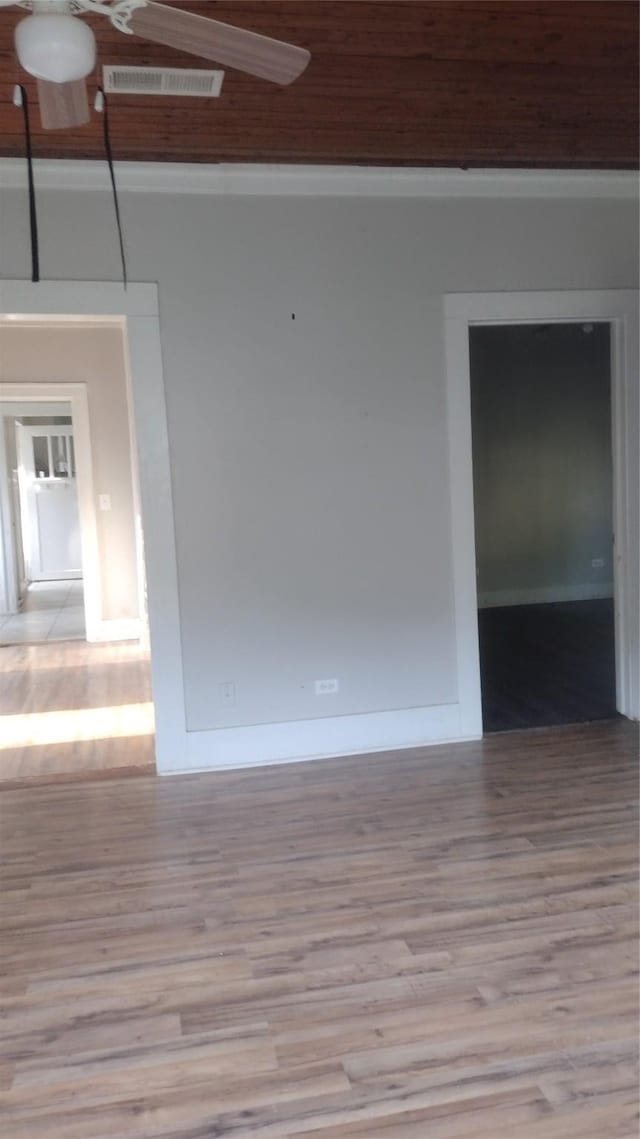 511 Chandler St, Minden, LA 71055 - empty room featuring visible vents, baseboards, wood finished floors, and crown molding