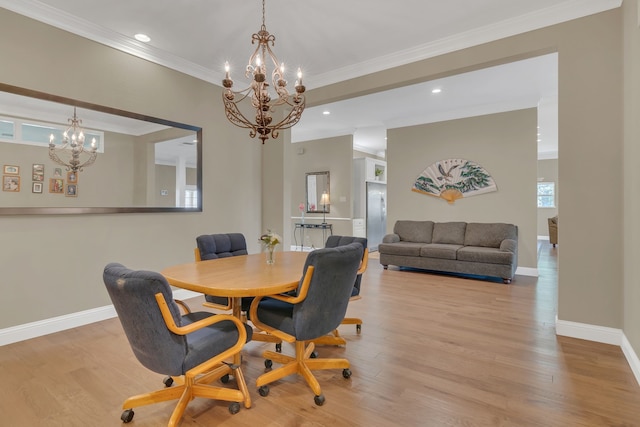 327 Saddle Club Rd, Weatherford, TX 76088 - dining area with wood finished floors, baseboards, a notable chandelier, and ornamental molding