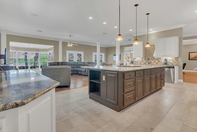 327 Saddle Club Rd, Weatherford, TX 76088 - kitchen with white cabinets, ornamental molding, stainless steel dishwasher, and decorative backsplash