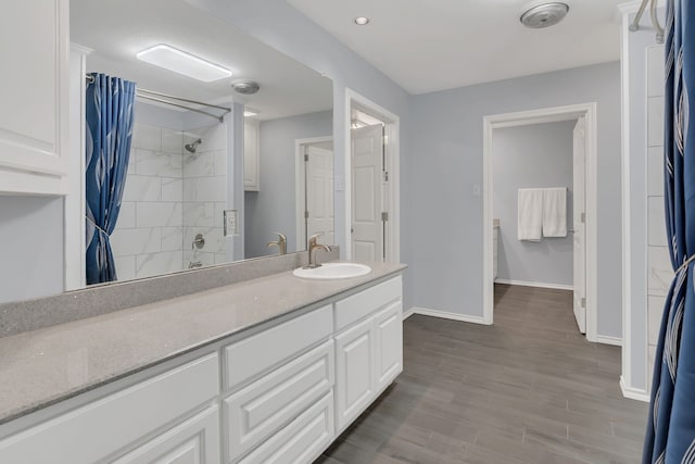 327 Saddle Club Rd, Weatherford, TX 76088 - bathroom featuring a shower with curtain, wood finished floors, baseboards, and vanity