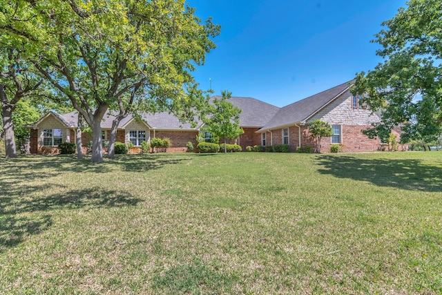 327 Saddle Club Rd, Weatherford, TX 76088 - exterior space with a front lawn and brick siding