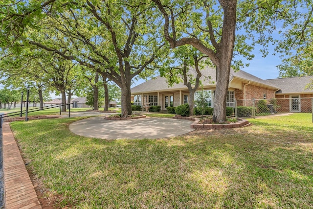 327 Saddle Club Rd, Weatherford, TX 76088 - exterior space featuring fence, brick siding, a yard, and roof with shingles