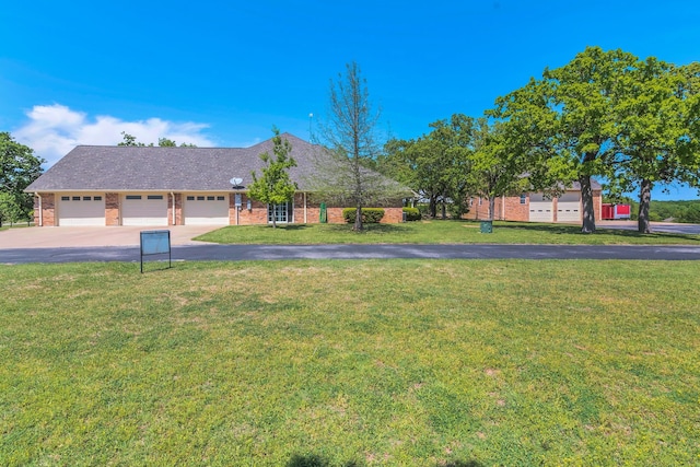 327 Saddle Club Rd, Weatherford, TX 76088 - ranch-style house featuring an attached garage, driveway, brick siding, and a front yard