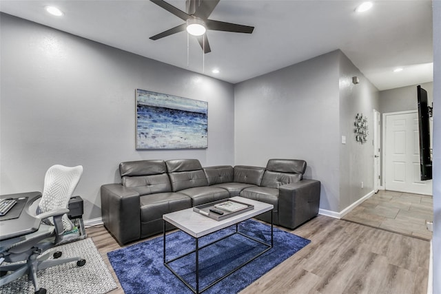 living room with ceiling fan, baseboards, light wood-style floors, and recessed lighting