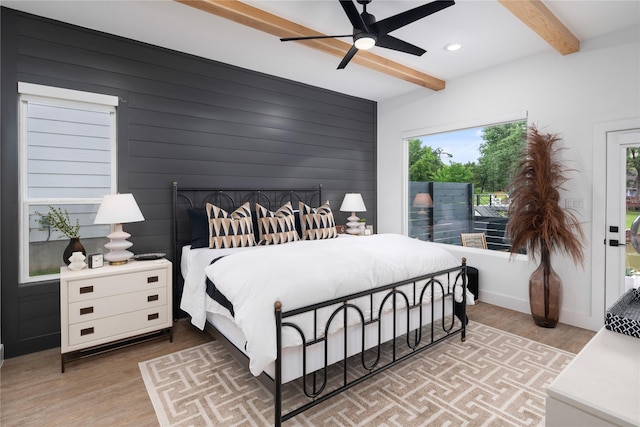 bedroom featuring a ceiling fan, recessed lighting, beam ceiling, and wood finished floors