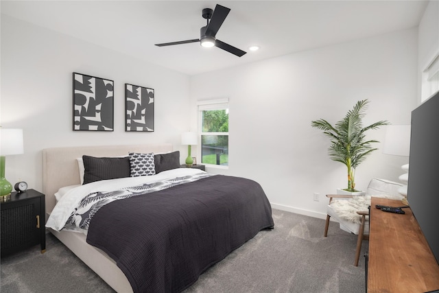 carpeted bedroom with baseboards and ceiling fan