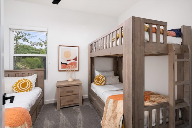 carpeted bedroom with baseboards