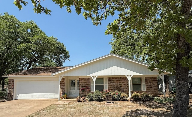 411 Briarwood Dr, Eastland, TX 76448 - ranch-style house with brick siding, an attached garage, and driveway